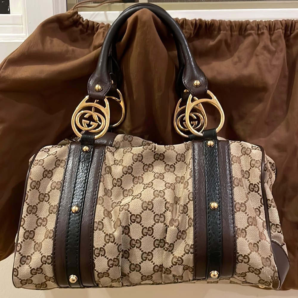 Gucci GG canvas Boston bag with brown and black leather and gold hardware.